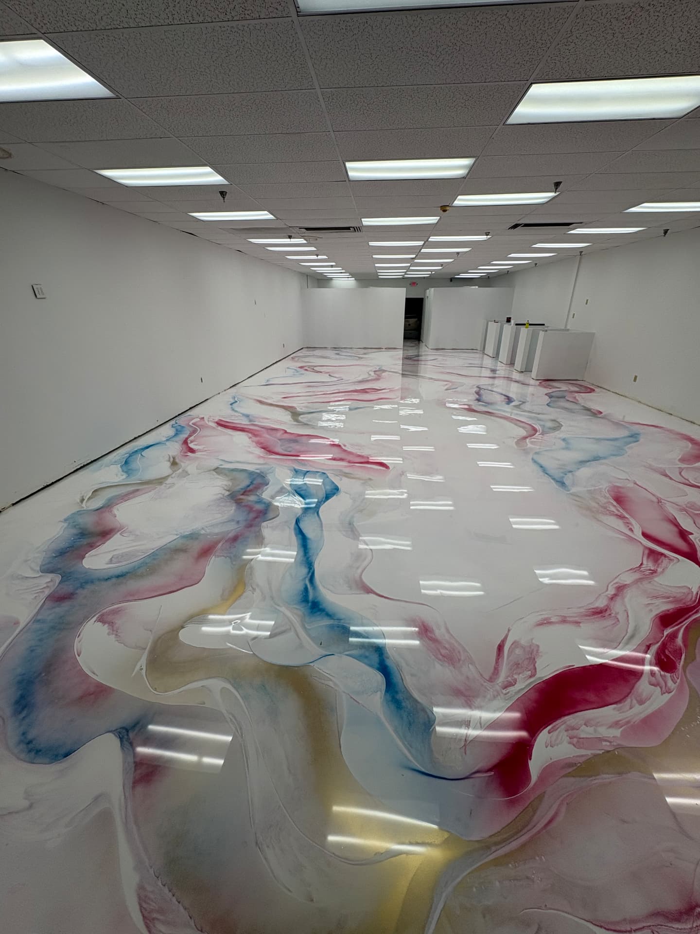 Retail floor finished with a high-gloss metallic epoxy coating